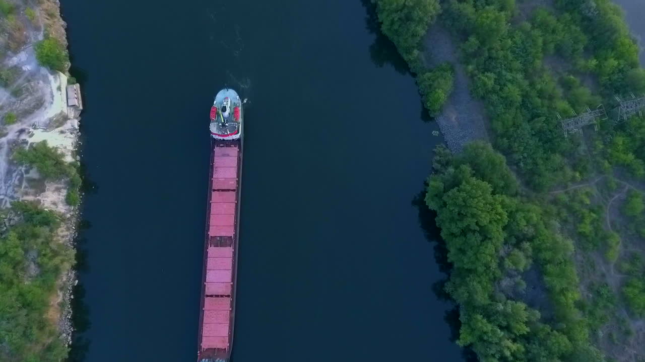 Comercial ship navigating over the Zaporizhzhia canal at the Dnipro river