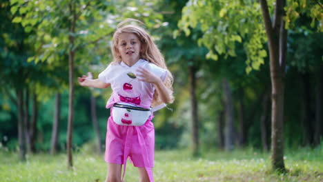 portrait of beautiful girl. adorable girl dancing on the meadow