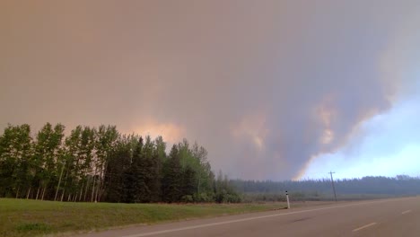 thick smoke caused by devastating wildfire in alberta, canada