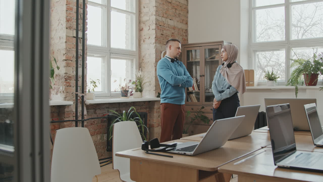 Call Center Workers Chatting in Office