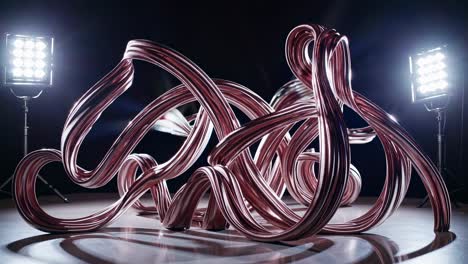 rose gold abstract sculpture under studio lighting