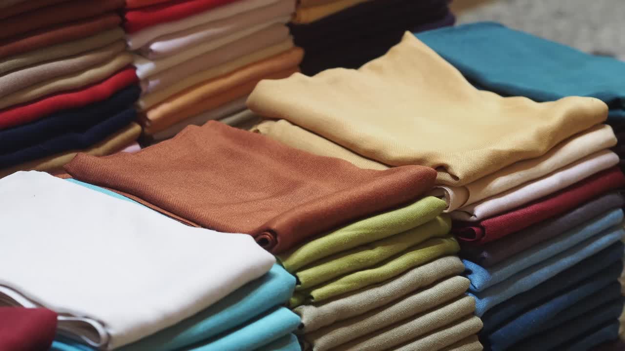 Close-up of Stacks of Colorful Folded Fabrics