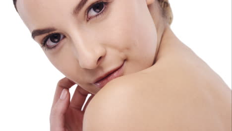 beauty portrait of woman touching beautiful face in slow motion skincare concept on a white background