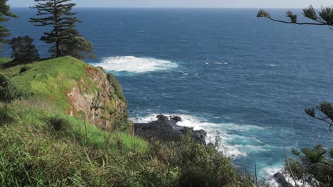 Static-shot-of-crashing-ocean-waves-on-Norfolk-Island-Anson-Bay-Road