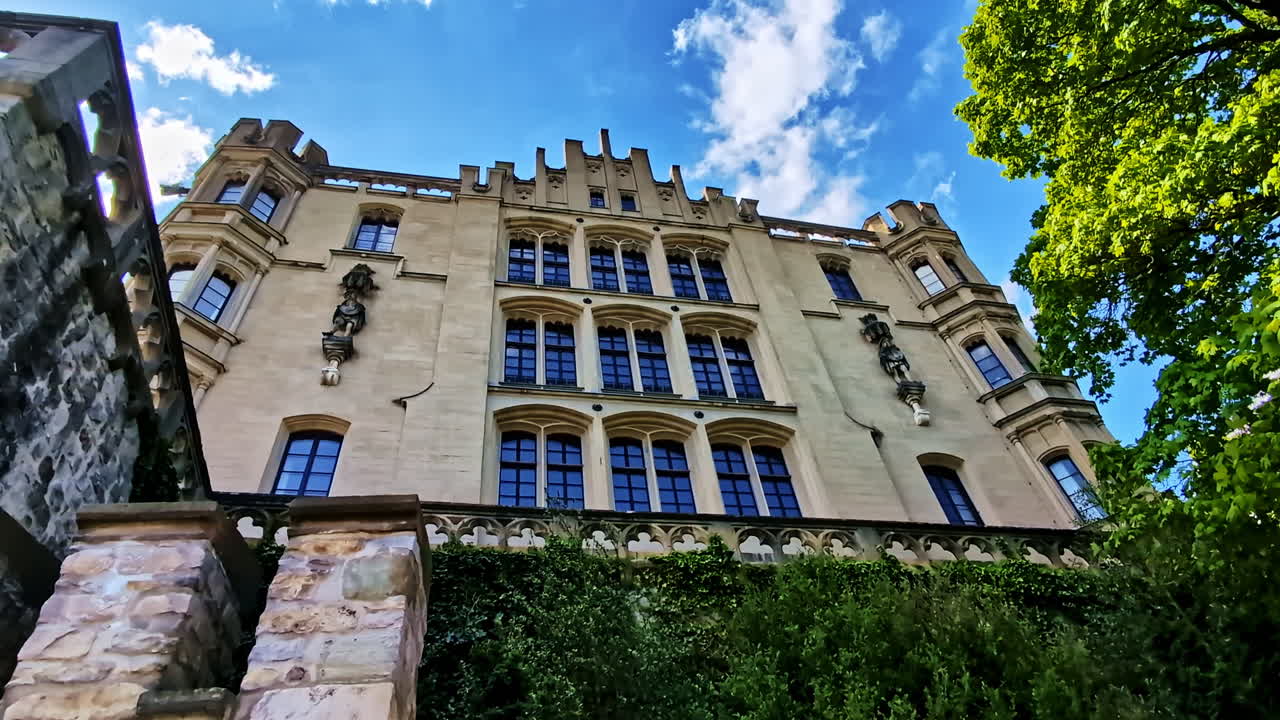 Historical Royal Villa Facade With Tall Arched Windows In Regensburg, Germany. low angle shot
