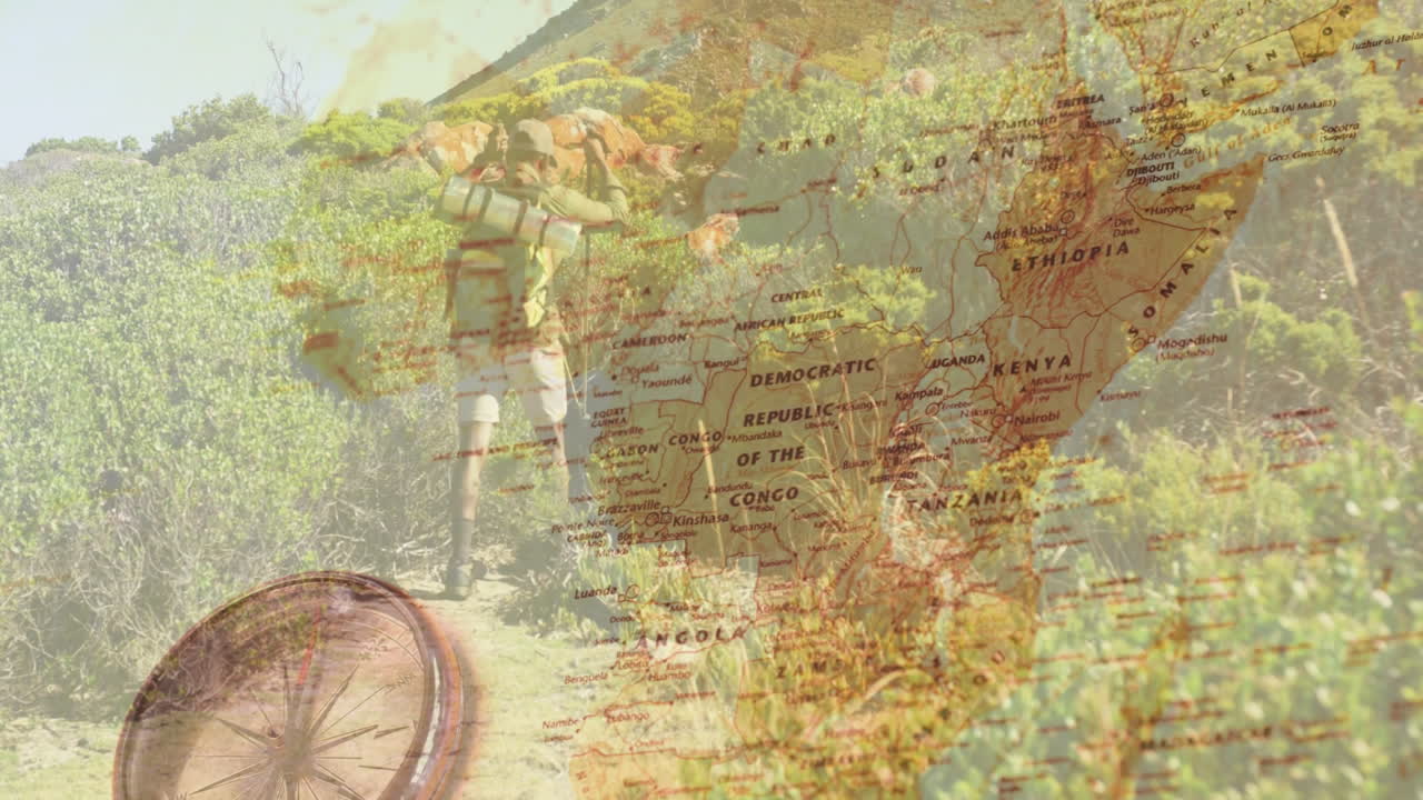 Male hiker trekking uphill via scrubland, tracking travel path with map and compass overlay