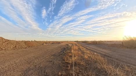 panning time lapse of desert road and construction dirt pile in gilbert arizona
