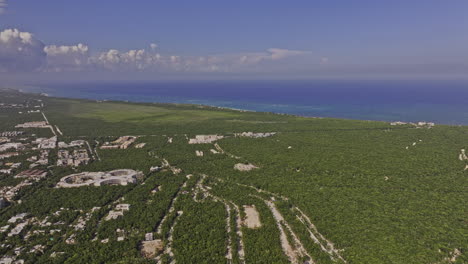 Tulum-Mexico-Aerial-v18-panoramic-drone-flyover-Outer-luxury-neighborhood-capturing-coastal-landscape-of-national-park,-resort-town-center-and-pristine-ocean---Shot-with-Mavic-3-Pro-Cine---July-2023