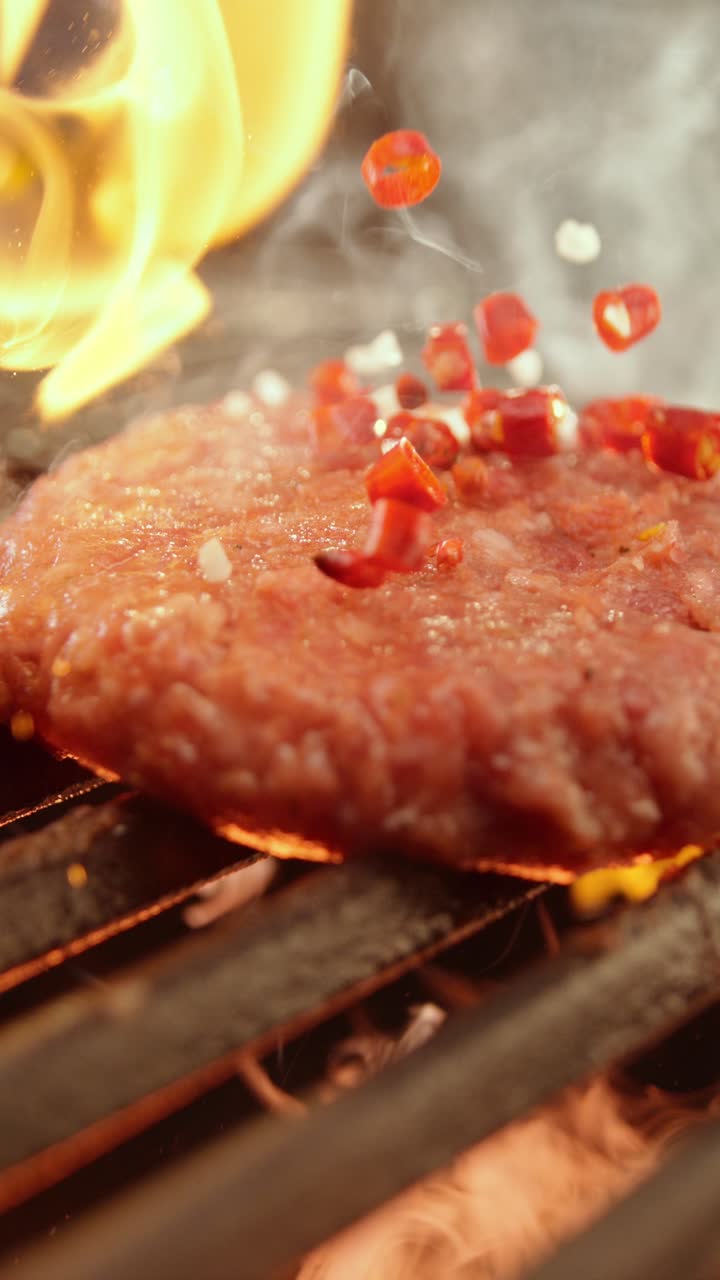 Burger on the Grill with Flames and Spices