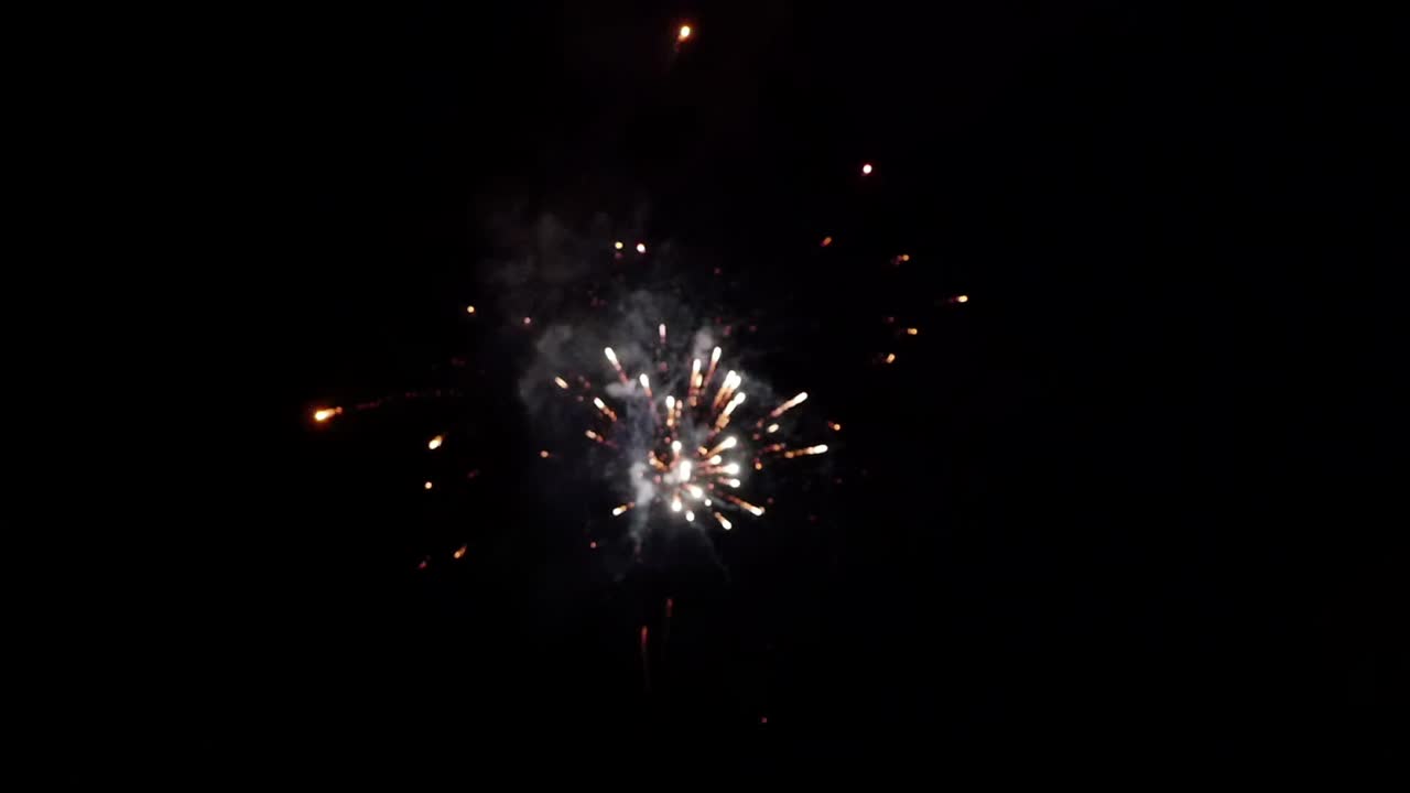 Fireworks display on dark night sky in slow motion blur