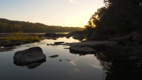 peaceful sunrise on the james river in richmond virginia during autumn