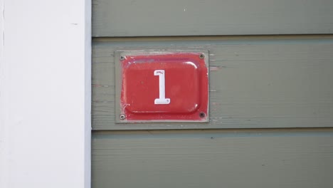 House Number 1 on a wall