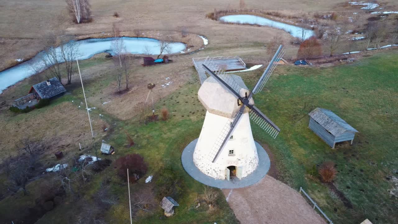 Old Araisi Windmill in Latvia Aerial Shot From Above. Winter Day at Sunrise. This Is the Only Windmill in Latvia at Working Order Built in 1852. 4K Shot