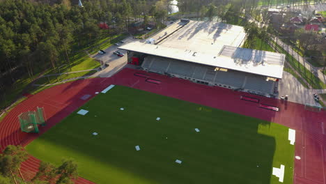 aerial view of modern sports stadium and surrounding area