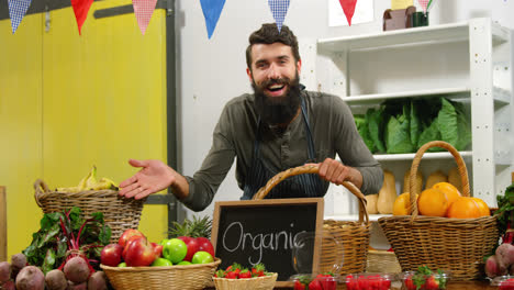 Smiling-staff-standing-in-organic-section