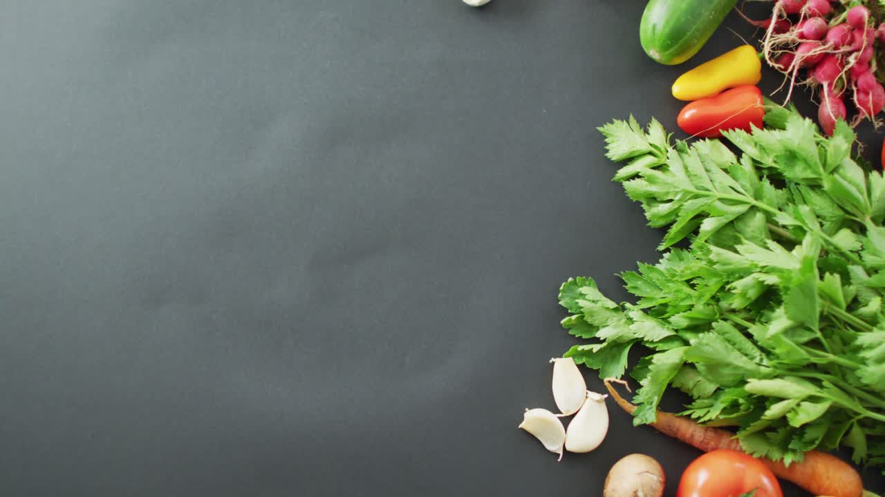Video of fresh vegetables with copy space over grey background
