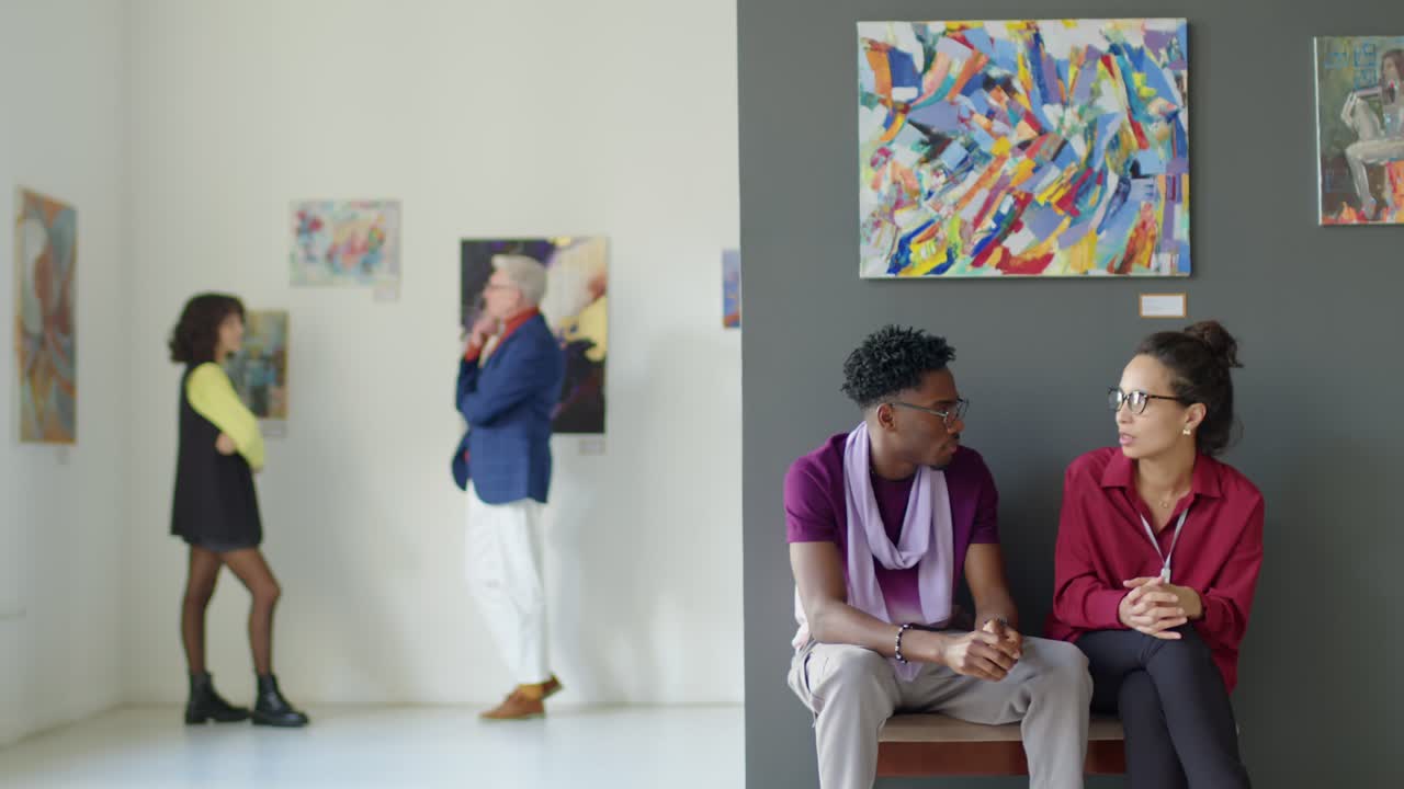 Couple Chatting in Art Gallery