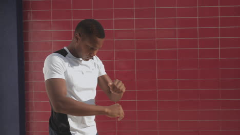 young male athlete stretching before running outdoors