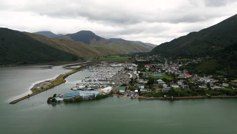 scenic havelock town marina with anchored boats, pelorus sounds, new zealand aerial