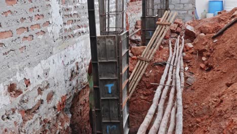 column foundation construction work | building site preparation and reinforcement. day time, slight pan shot, 4k
