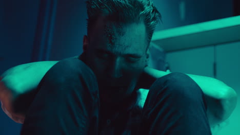 distressed man in neon light
