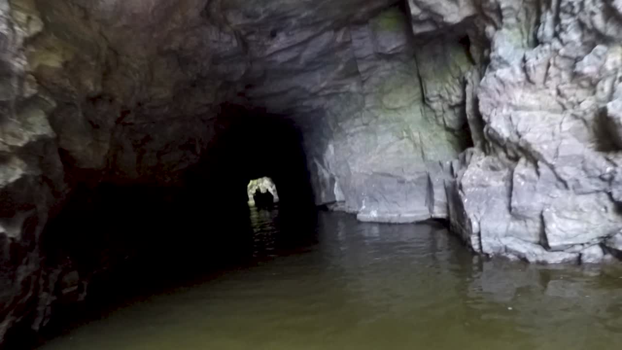 Dark Cave Tunnel Entrance with Water