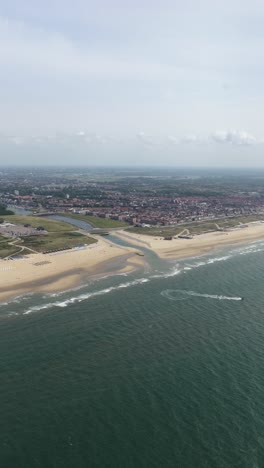 vertical aerial video of katwijk, north holland, the netherlands, village along the north sea