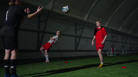 girls soccer team training indoors