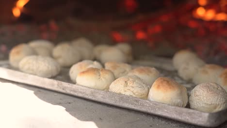 cooking bread in clay oven traditional bakery of pastry in slow motion