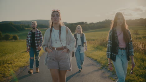 male and female friends walking on footpath