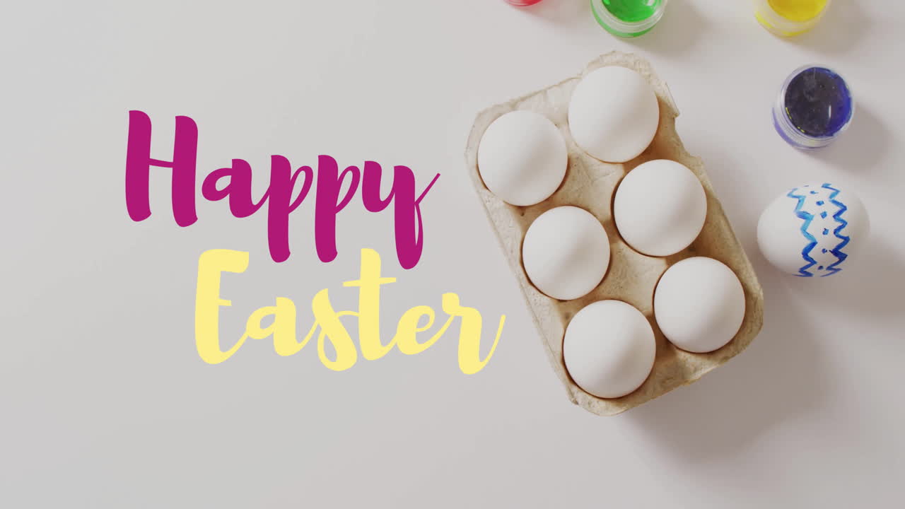 Animazione del testo "Buona Pasqua" su uova di Pasqua e colori su sfondo bianco.