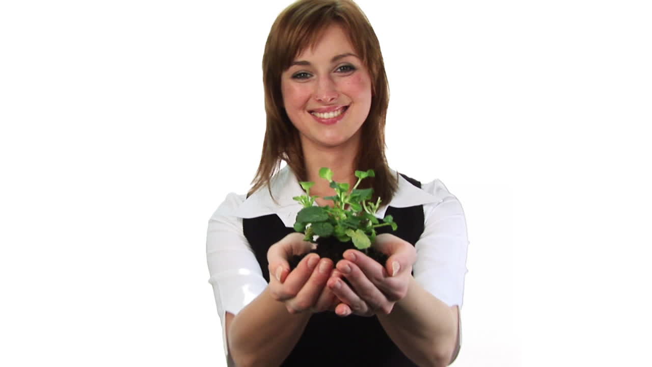 Woman holding a plant