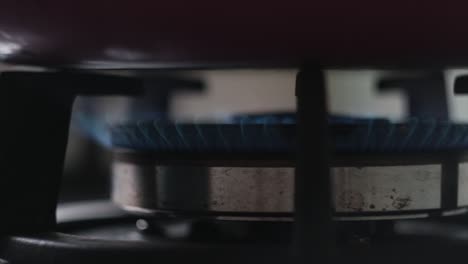 1080p | slow motion of stuff opening with spark and flame for cooking in kitchen