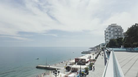 coastal city beach scene with hotels and tourists