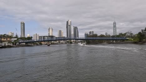 time-lapse of boats on river against city skyline.