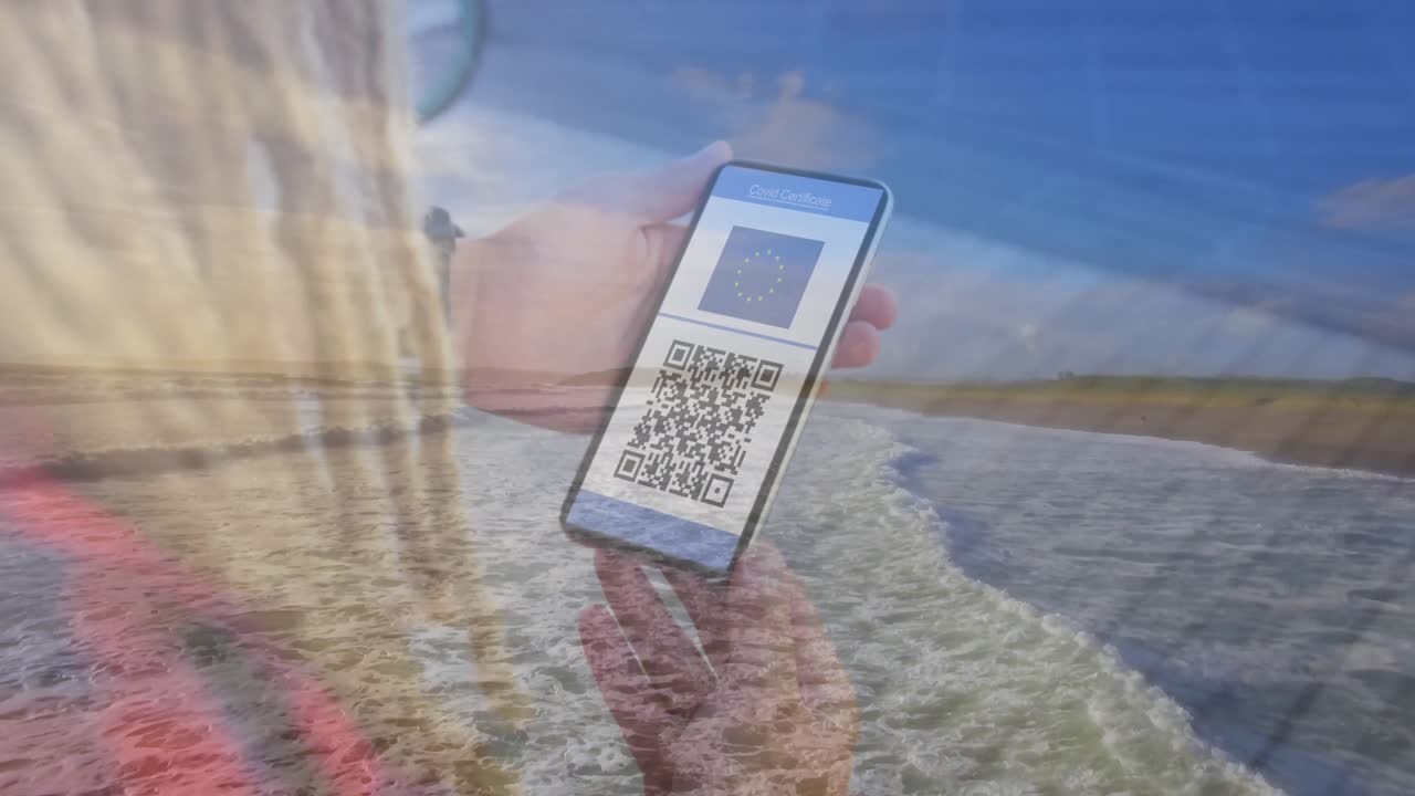 Composition of woman holding a smartphone with qr code on screen against aerial view of the beach