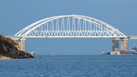 white arch bridge over waterway