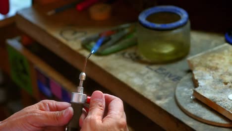 craftswoman using blowtorch