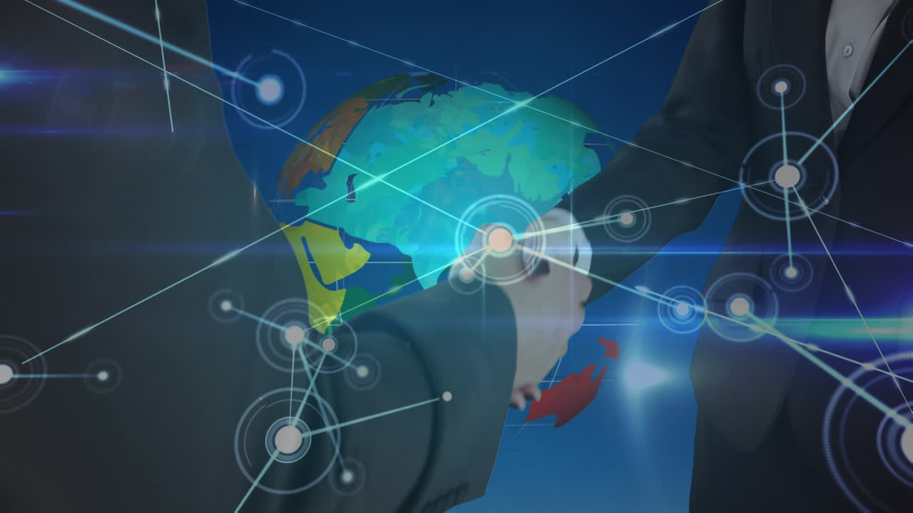 회전하는 지구에 대항하여 손을 흔드는 두 사업가의 중간 섹션에 대한 연결망