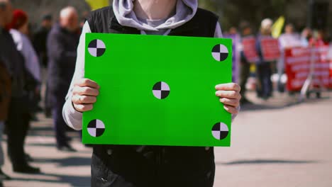 serious person on racial struggle manifest. close up of greenscreen banner 4k.