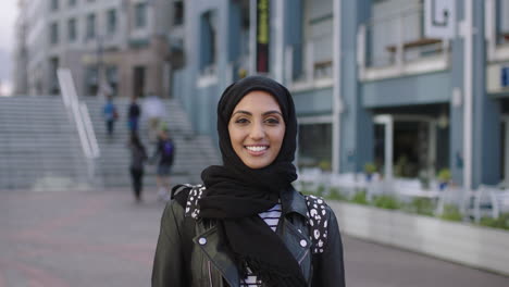 portrait of beautiful young middle eastern woman smiling happy enjoying urban lifestyle