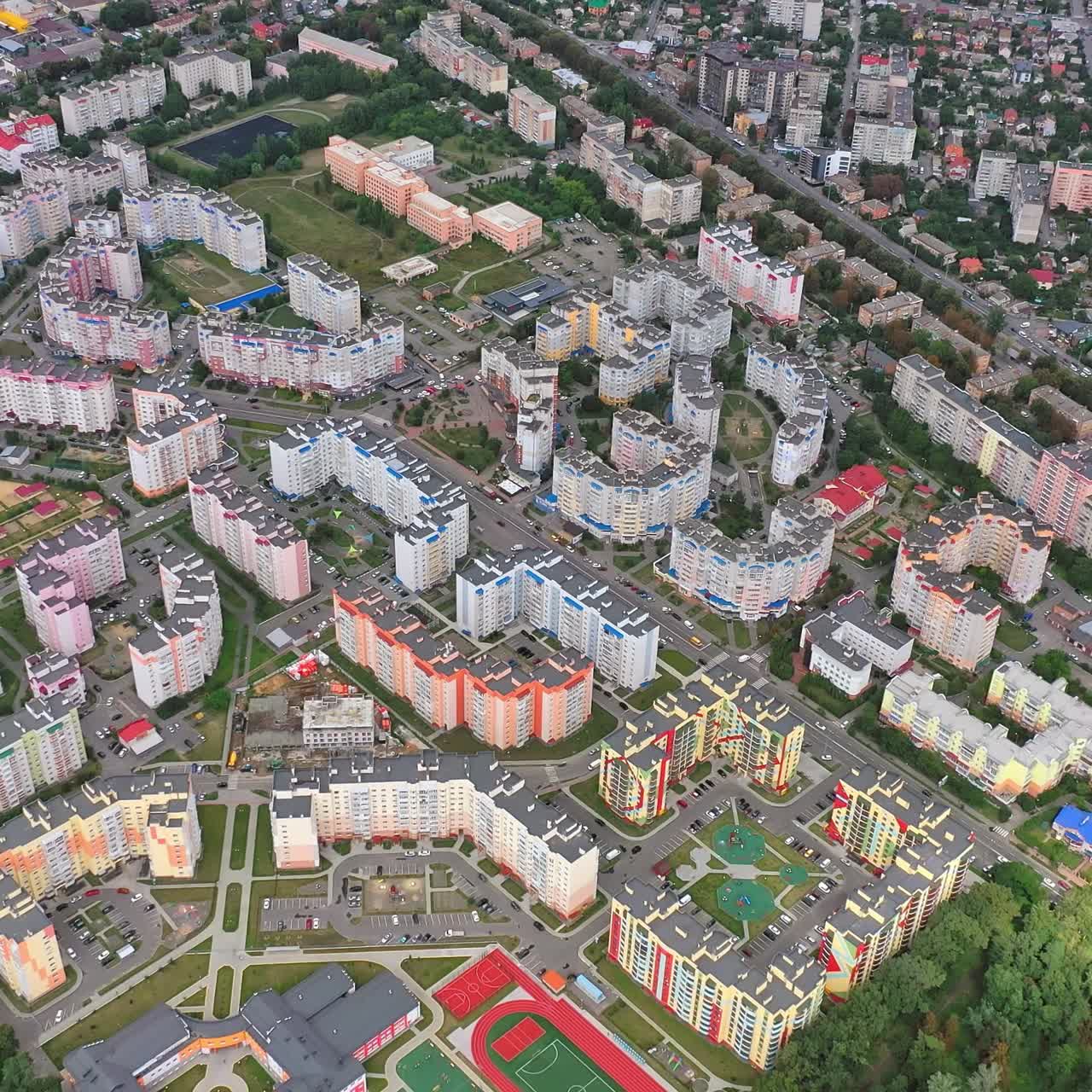Contemporary high-rise buildings on urban background. Residential apartments for citizens in modern district. Aerial view