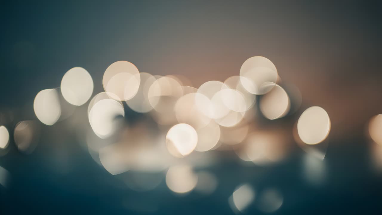 Shifting camera pulling focus toward cluster string lights on shiny surface revealing bulb housings