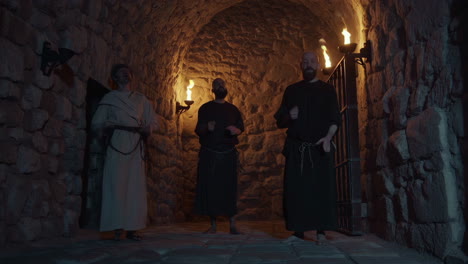 medieval monks in a dungeon