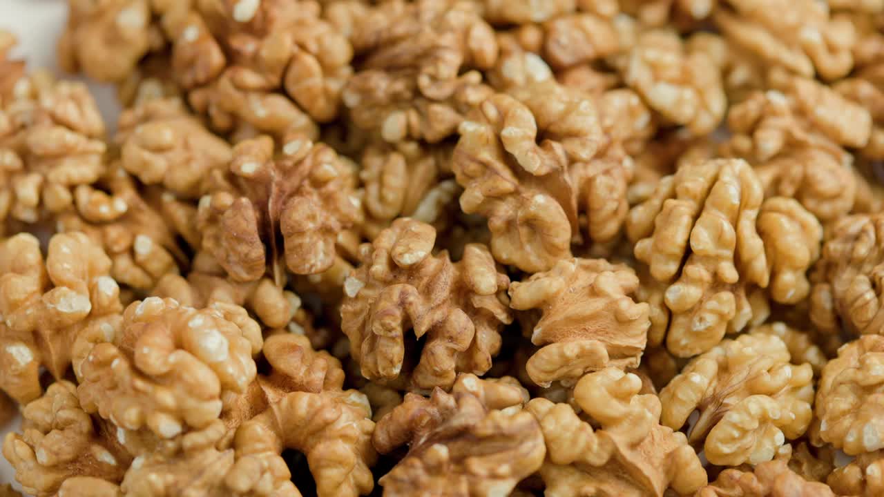looped spinning walnuts without the shell close-up full frame background