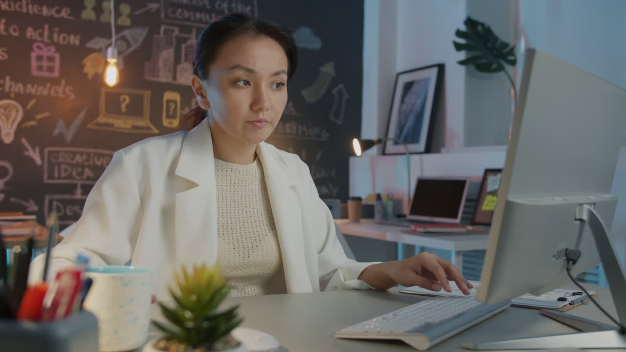 Woman working on computer in a modern home office