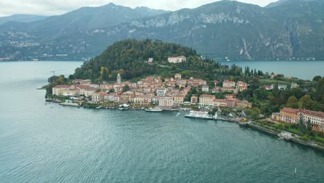 AERIAL:-Boat-Sails-to-Port-of-Bellagio-Town-in-Lake-Como