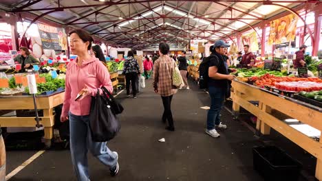 people shopping at a bustling market