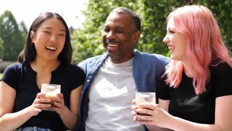 a joyful gathering of friends enjoying refreshing beverages in a sunlit outdoor setting, sharing laughter and good vibes together