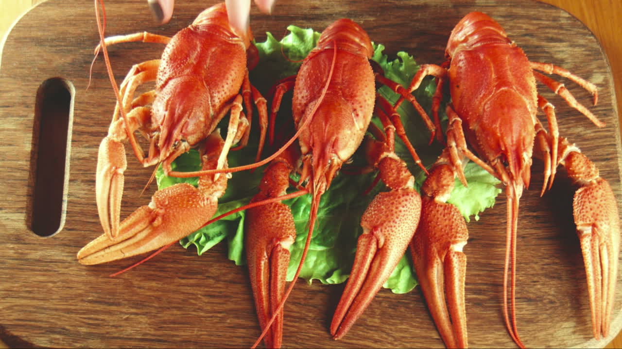 Crayfish with Salad on a Wooden Board